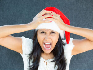 woman in santa hat screaming